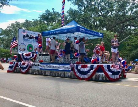 People on a parade float in the Southport, NC parade