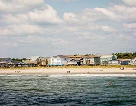 Oceanfront houses along Oak Island beach