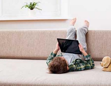 Kid playing with his ipad at a vacation rental