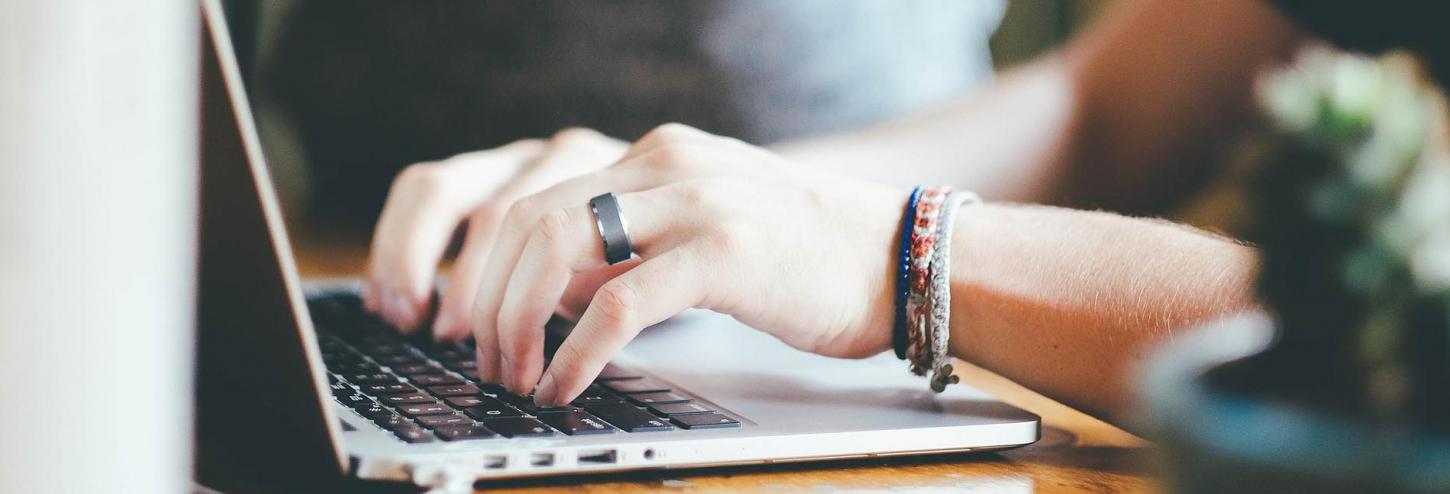 Woman typing on her computer