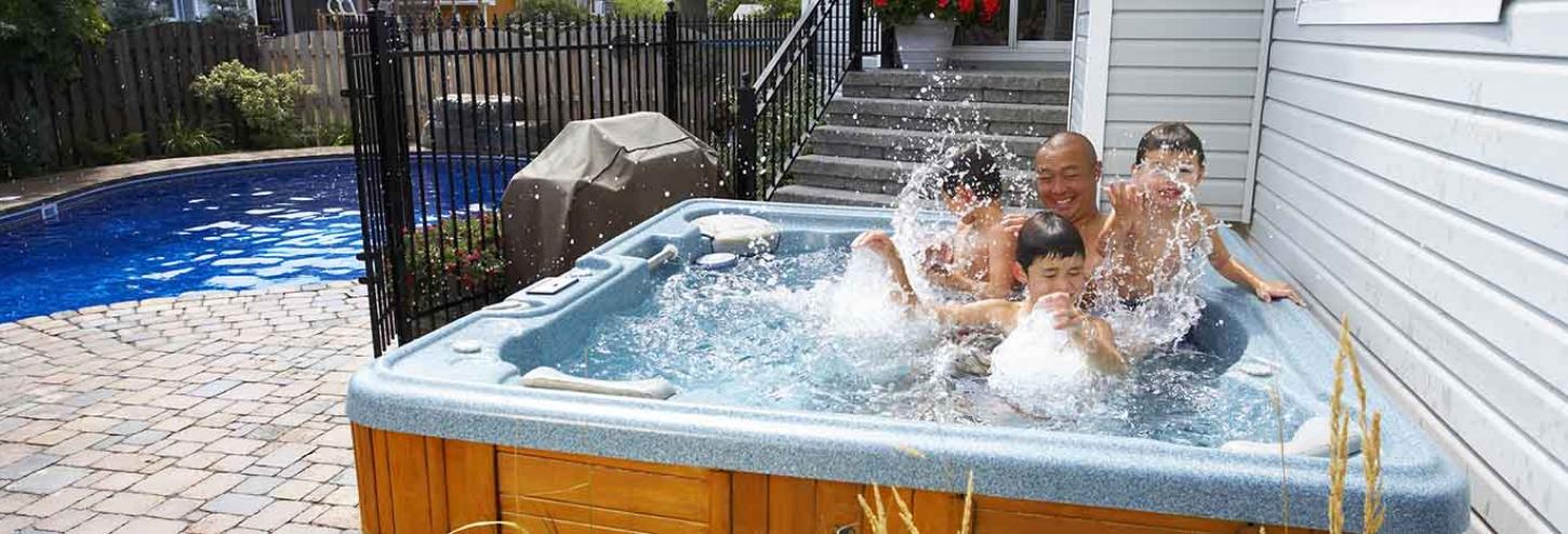 Family enjoying a hot tub at a vacation rental