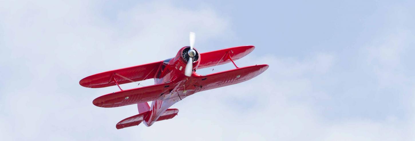 Biplane flying through the sky