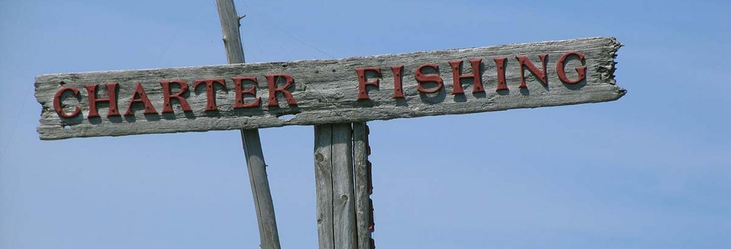 Fishing charters sign on a bright blue background