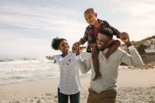 Family on the beach in the fall