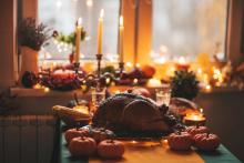 turkey on a table set for thanksgiving