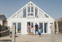 family outside vacation rental home