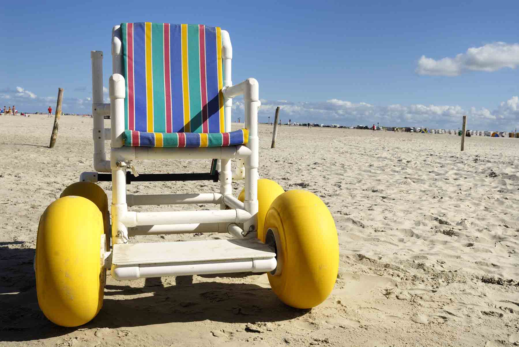 Colorful beach wheel chair on an Oak Island beach