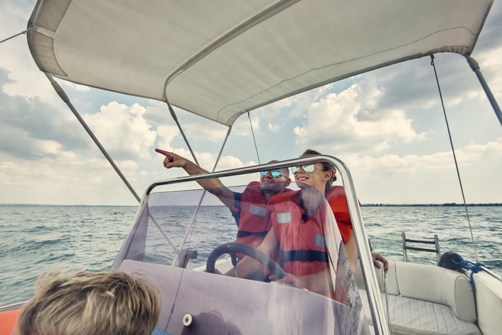 A family rides in a rental boat