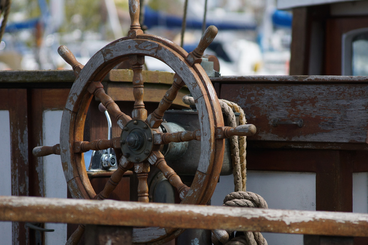 A ship wheel at a maritime museum A ship wheel at a maritime museum