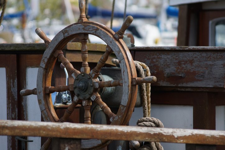 A ship wheel at a maritime museum