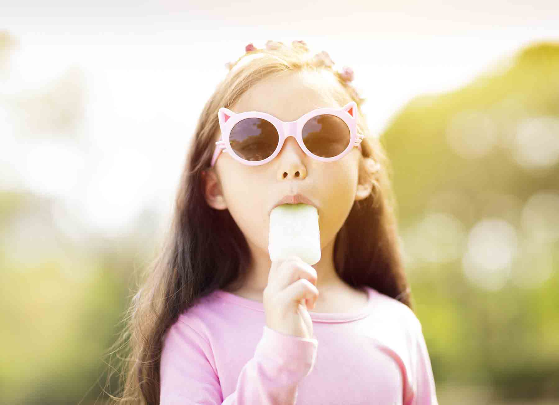 Girl enjoying a fruit pop