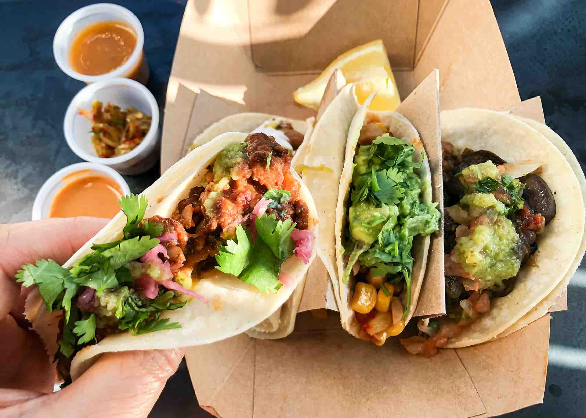 Tacos in a to go container at a taqueria