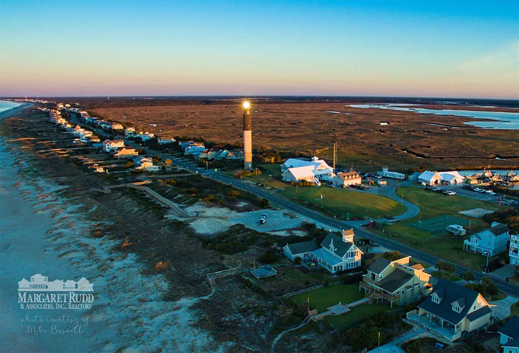 Ariel view of Oak Island Lighthouse at sunset