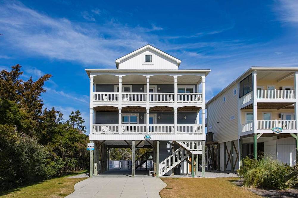 front view of beach house in Oak Island, NC featuring two long balconies