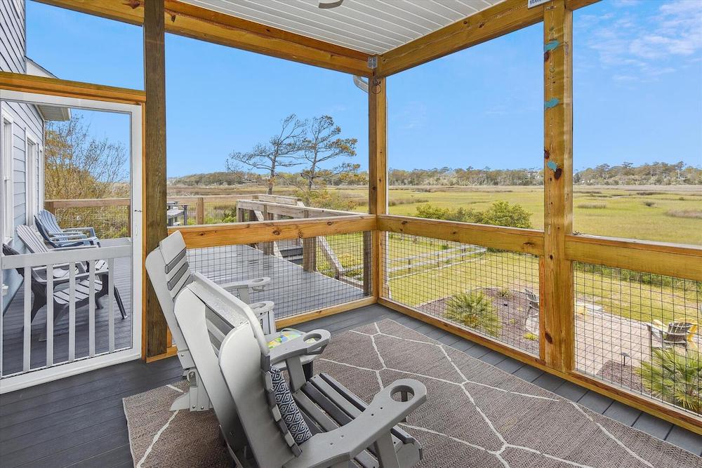 screened in porch of a beachfront vacation rental