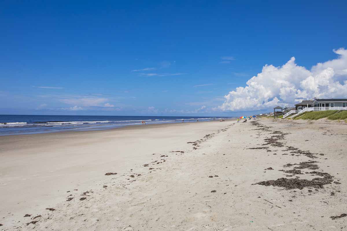 Sandy beach on a sunny day in Oak Island, NC. 