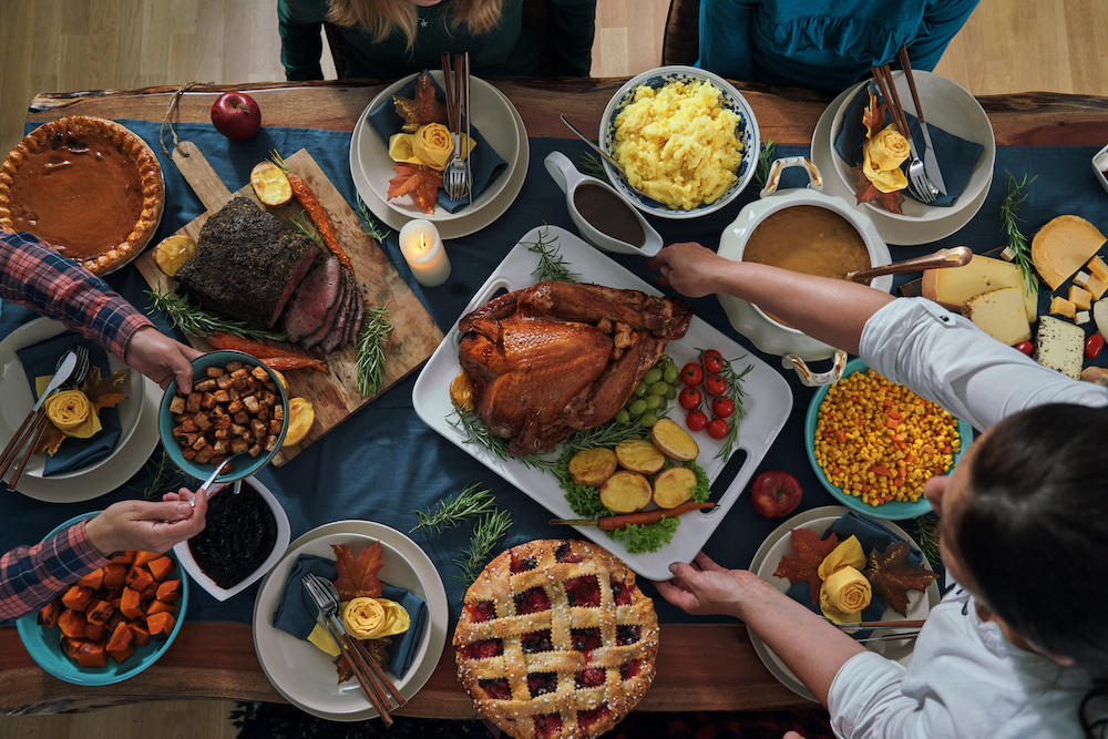 table set with thanksgiving staples