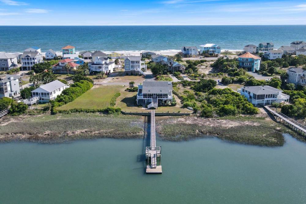 vacation rental with view of dock over canal 