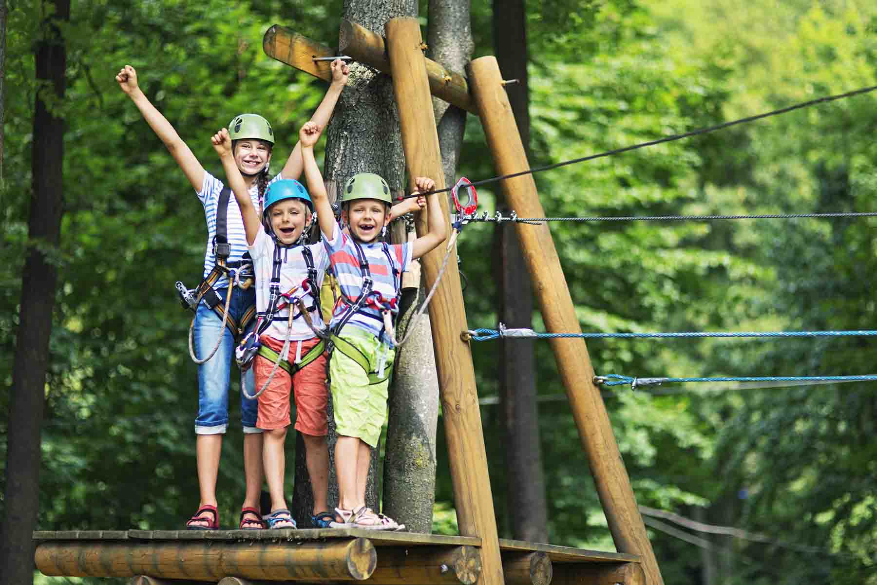 Kids zip lining at Shallottee Park in North Carolina